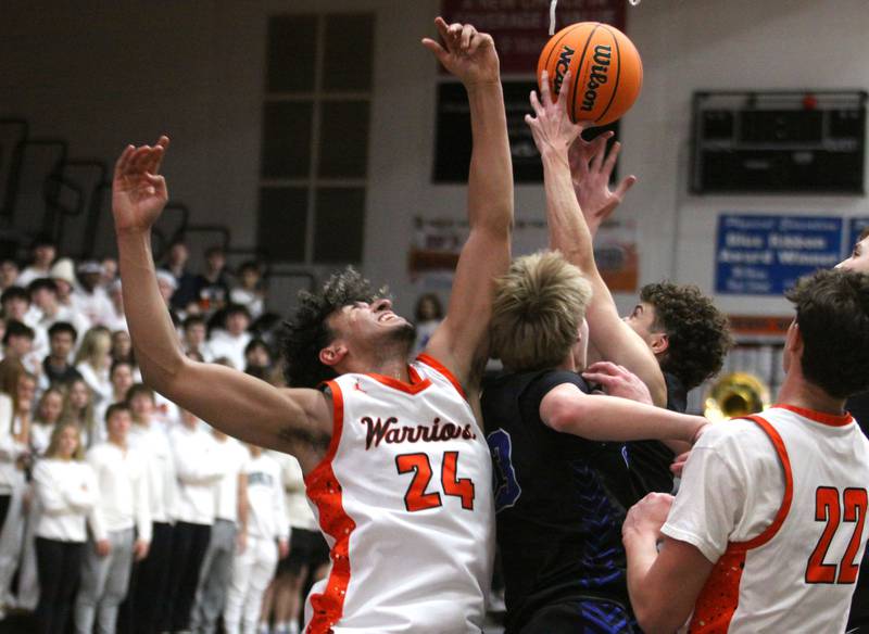 McHenry’s Adam Anwar and others battle for the ball in a game against Burlington Central in varsity boys basketball on Friday, Dec. 5, 2025, at McHenry Community High School in McHenry.