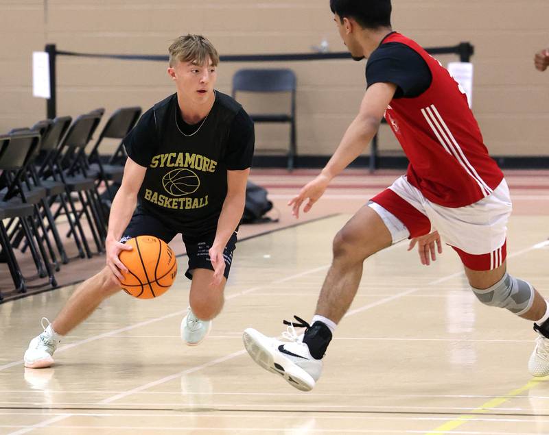 Sycamore’s Xander Lewis brings the ball up the court Friday, June 20, 2025, during their game against Marmion in the DeKalb Live summer tournament at DeKalb High School.
