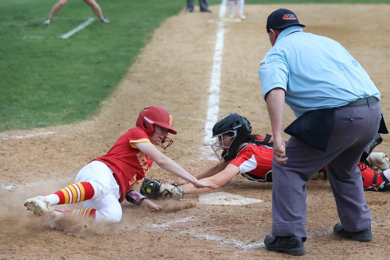 Bradley-Bourbonnais’ Suttyn Hop dives to tag out a Rock Island runner at home plate, keeping the Boilermakers alive to reach a 7-1 victory in 11 innings over Rock Island in the IHSA Class 4A Bradley-Bourbonnais Regional championship on Friday, May 30, 2025.