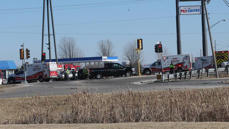 Emergency crews work the scene of a multiple vehicle crash at the intersection of Illinois Route 251 and May Road on Monday, May, 27, 2025 in Peru. The crash happened around 12:45p.m. Ambulances from Peru, La Salle, Mendota Spring Valley, and Oglesby responded to the scene to transport multiple victims to area hospitals.