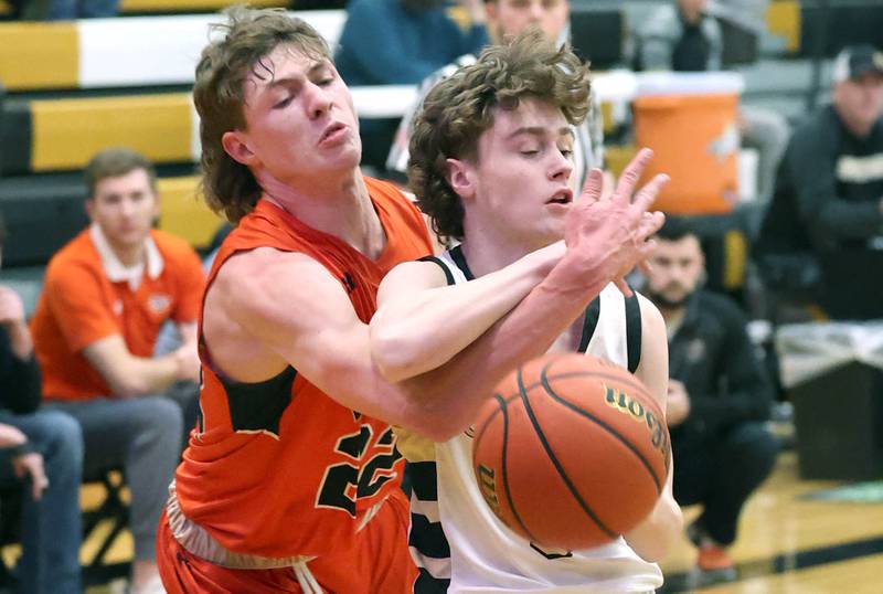 Sandwich's Austin Marks tries to steal the ball from Sycamore's Preston Picolotti during their game Tuesday, Jan. 17, 2023, at Sycamore High School.
