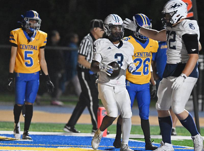 Plainfield South's Kamrin Childress (3) celebrates with David Daniluk (72) after scoring a touchdown during the conference game against Joliet Central on Friday, OCT. 17, 2025, at Joliet.