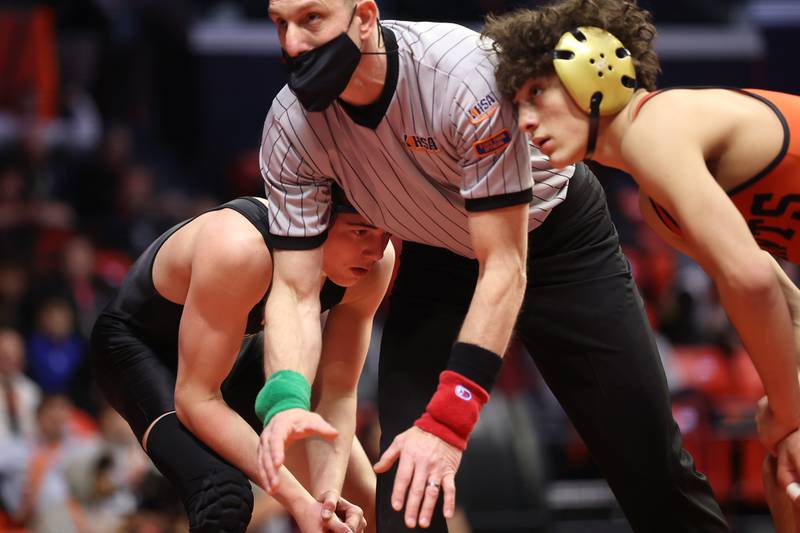 Providence’s Billy Miszner (left) waits for the referee to start the match against St. Charles’ Cody Tavoso in the Class 3A 132lb. 3rd place match at State Farm Center in Champaign. Saturday, Feb. 19, 2022, in Champaign.