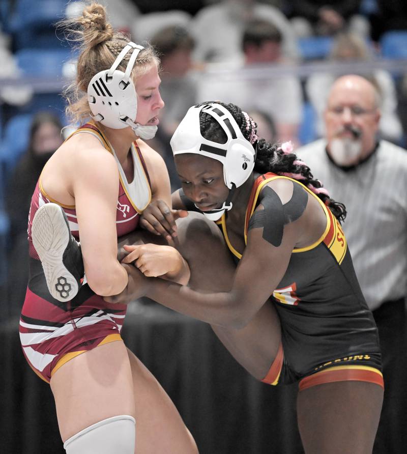 Lockport’s Claudia Heeney, left, controls Schaumburg’s Sharon Olorunfemi to her third consecutive championship, this year in the 135-pound class at the girls wrestling state finals tournament at Grossinger Arena in Bloomington on Saturday, Feb. 28, 2026.