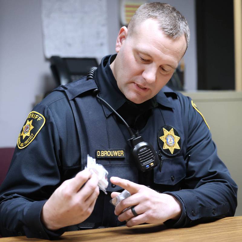DeKalb County sheriff’s deputy Doug Brouwer talks Friday, March 22, 2024, at the Sheriff’s Office in Sycamore, about the Narcan opioid overdose treatment spray and how it is administered to the patient.
