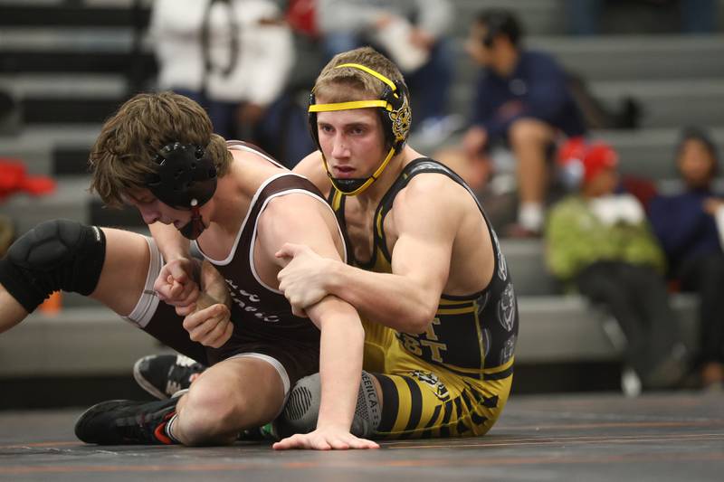 Joliet West’s Coehn Webber wraps up Joliet Catholic’s Dawson Mack in the Class 3A Minooka Regional 150 pound championship on Saturday, Jan. 31, 2026 in Minooka.