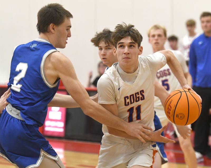 Genoa-Kingston's Benjamin Kleba makes a move to the basket as Sterling Newman's Asher Ernst defends at the Oregon Boys Basketball Thanksgiving Tournament on Wednesday, Nov. 26, 2025 at Oregon High School.