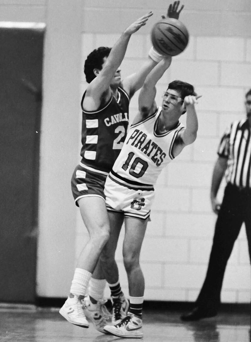 Ottawa's Brent Sonday passes the ball around L-P's Tom Happ during the Regional title game on Saturday, Feb. 28, 1986 at La Salle-Peru Township High School.