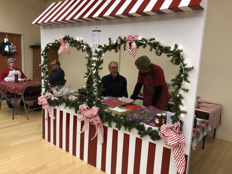 Vendors set up their booths where they will be selling cookies, coffee and other treats at the Christkindlmarket in Princeton on Saturday, Nov. 19, 2022.