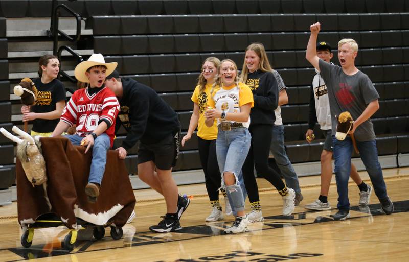 Putnam County High School freshman walk in the shopping cart parade during the football Homecoming Pep Rally on Friday, Sept. 27, 2024 at Putnam County High School in Granville.