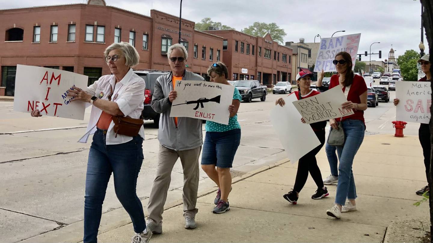 Protesters with Moms Demand Action marching onto the Route 38 bridge over the Fox River in Geneva Saturday May 13, 2023, to protest gun violence and call for legislative reform.