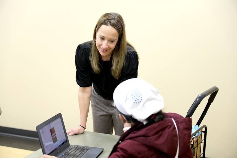 Heather Engelhart works with Chhomnath Long, a native of Cambodia, during reading class in Waubonsee Community College’s Adult Education Division at the Aurora campus.