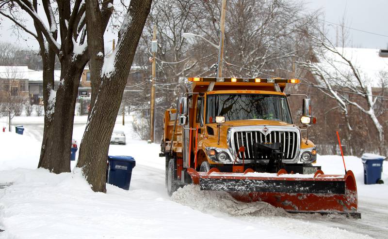 A St. Charles snow plow clears one of the city's streets after several inches of snow fell the morning of Monday, Jan. 24, 2022.