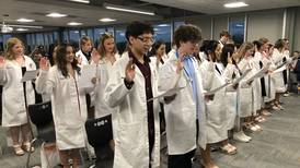 At McHenry High, students earn nursing assistant certifications, white coats