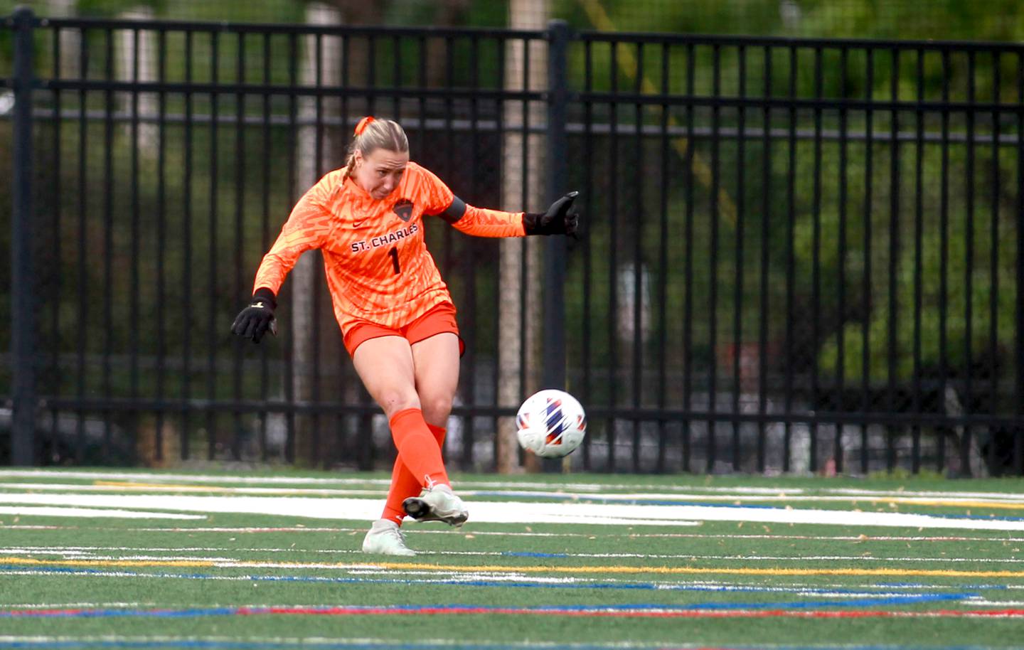 St. Charles East goal keeper Sidney Lazenby kicks the ball away during a Class 3A Glenbard West Sectional semifinal game against St. Charles North on Tuesday, May 27, 2025 in Glen Ellyn.