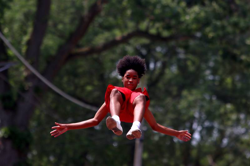 The Jesse White tumblers perform as part of the Fiesta Days parade along Main Street in McHenry Sunday.
