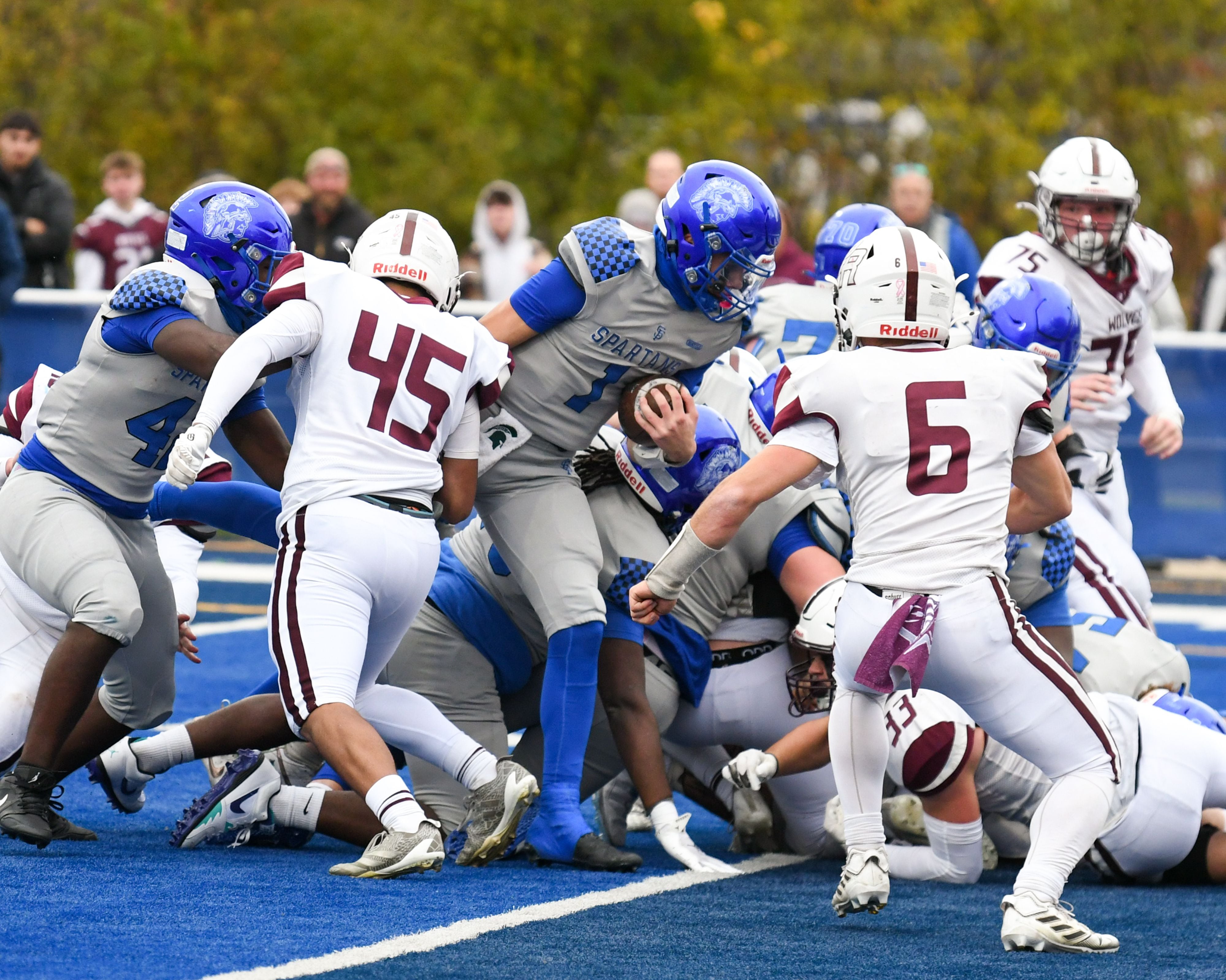 St. Francis's Brock Phillip (1) runs in for a touchdown while being defended by Prairie Ridge during the second round of the 5A playoff game held on Saturday Nov. 8, 2025, held at St. Francis's High School.