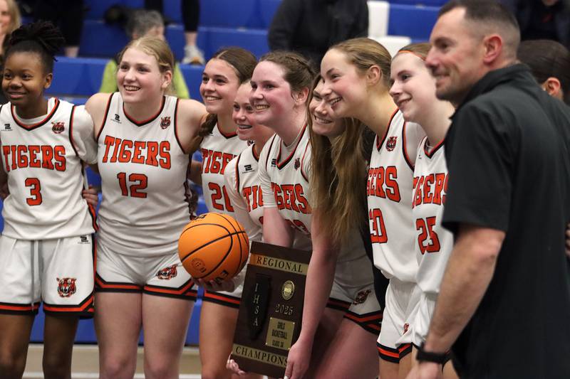 Crystal Lake Central’s Tigers celebrate a win over Burlington Central in IHSA Class 3A Regional Title Game girls basketball action on Thursday, Feb. 20, 2025, at  Central High School in Burlington.