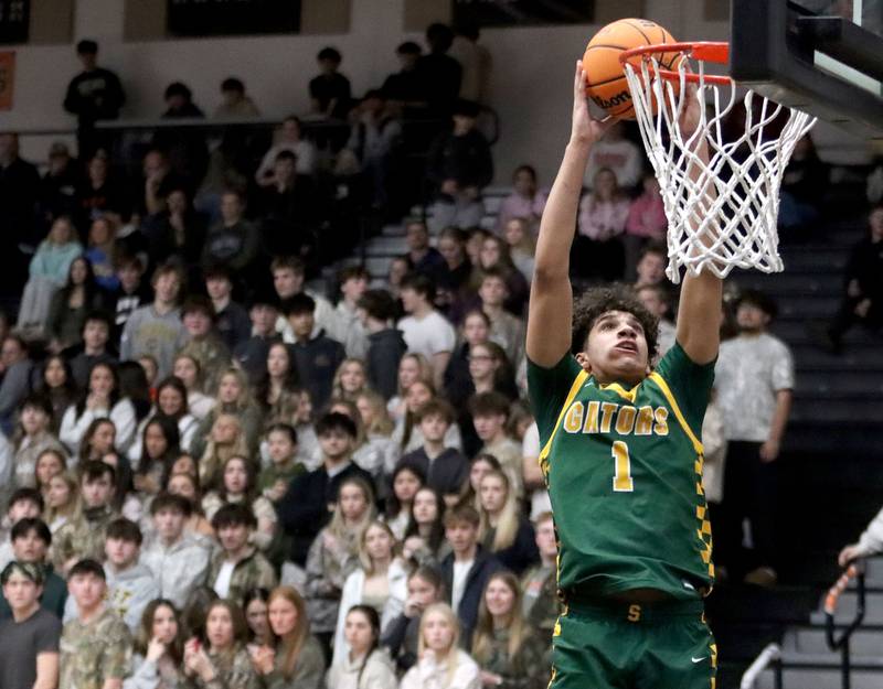 Crystal Lake South’s Noah Cook glides in for a dunk in varsity boys basketball on Friday, Feb. 20, 2026, at McHenry High School in McHenry.