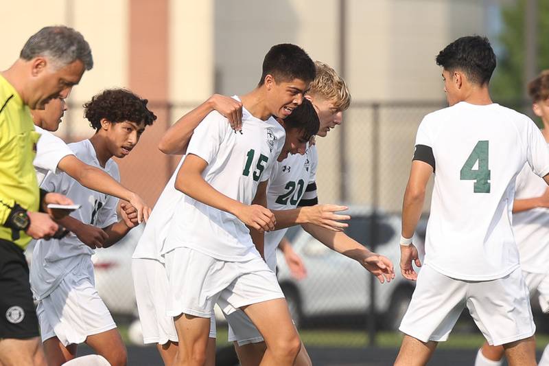Plainfield Central’s Sebastian Chavez (15) is mobbed by his teammates after a goal against Plainfield East on Tuesday, Sept. 19, in Plainfield.