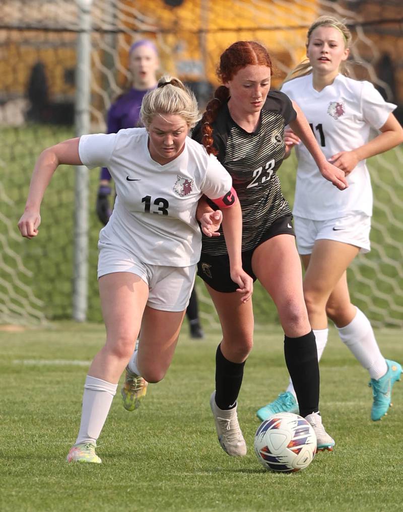 Prairie Ridge's Ellie King (left) and Sycamore's Izzie Segreti chase a loose ball during their game Wednesday, May 17, 2023, at Sycamore High School.