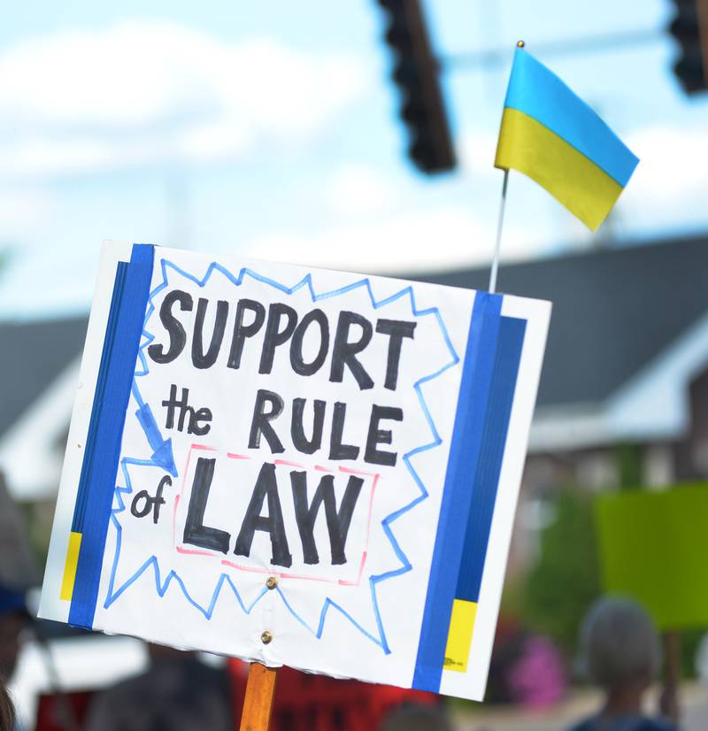 This sign along with a Ukranian flag were displayed at the "Workers Over Billionaires" rally in downtown Oregon on Monday, Sept. 1, 2025. Monday's event also included pro-Trump signs.