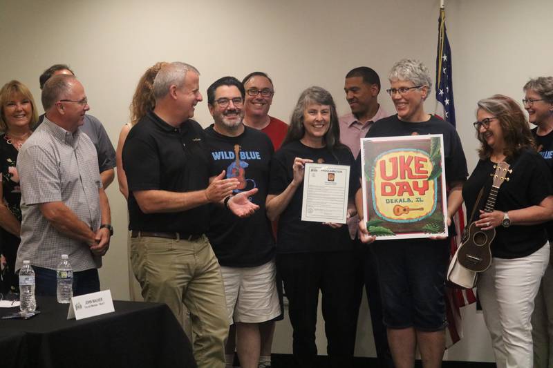 DeKalb city leaders bestow members of the Wild Blue Ukulele Orchestra with a proclamation at the July 24, 2023 meeting of the DeKalb City Council.