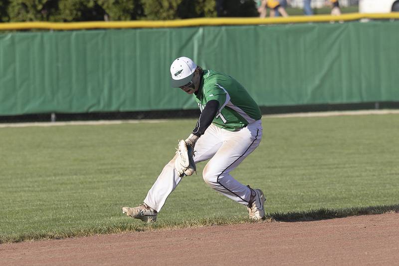 Rock Falls’ Tim Heald goes deep in the hole at shortstop but is unable to make the play for an out against Winnebago Thursday, April 27, 2023.