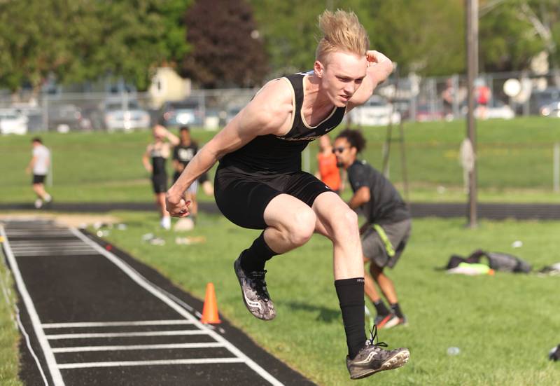 Sycamore's Noah Schmidt competes in the triple jump Friday, May 13, 2022, during the Interstate 8 Conference Championship meet at Sycamore High School.