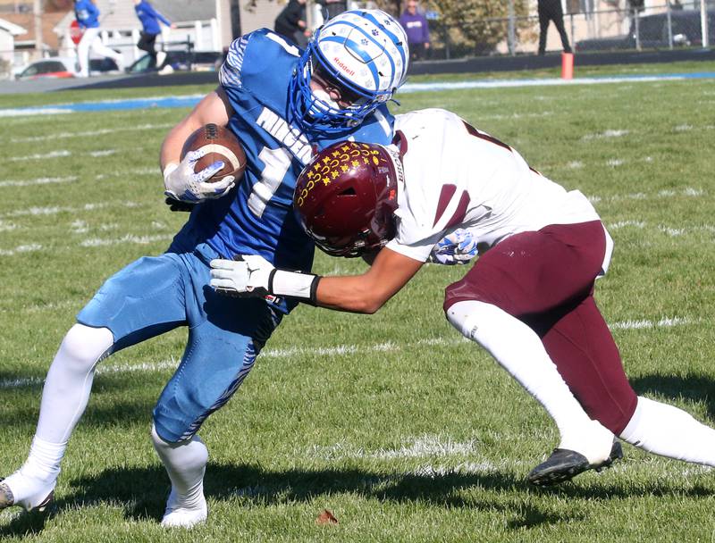 Princeton's Casey Etheridge is pushed out of bounce by Montini Catholic's Jeremiah Peterson on Saturday, Nov. 11, 2023 at Bryant Field in Princeton.