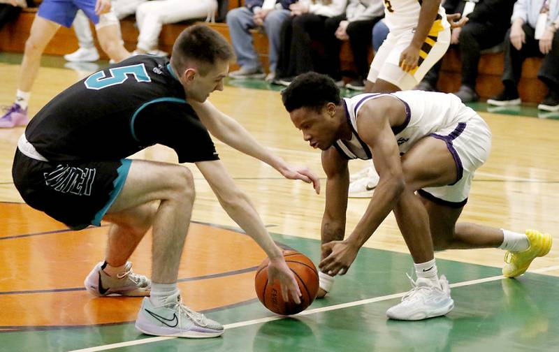 Woodstock North's Aj Bigler and Hampshire's Chayse Gray go after a loose ball during the boy’s game of McHenry County Area All-Star Basketball Extravaganza on Sunday, April 13, 2025, at Alden-Hebron’s Tigard Gymnasium in Hebron.
