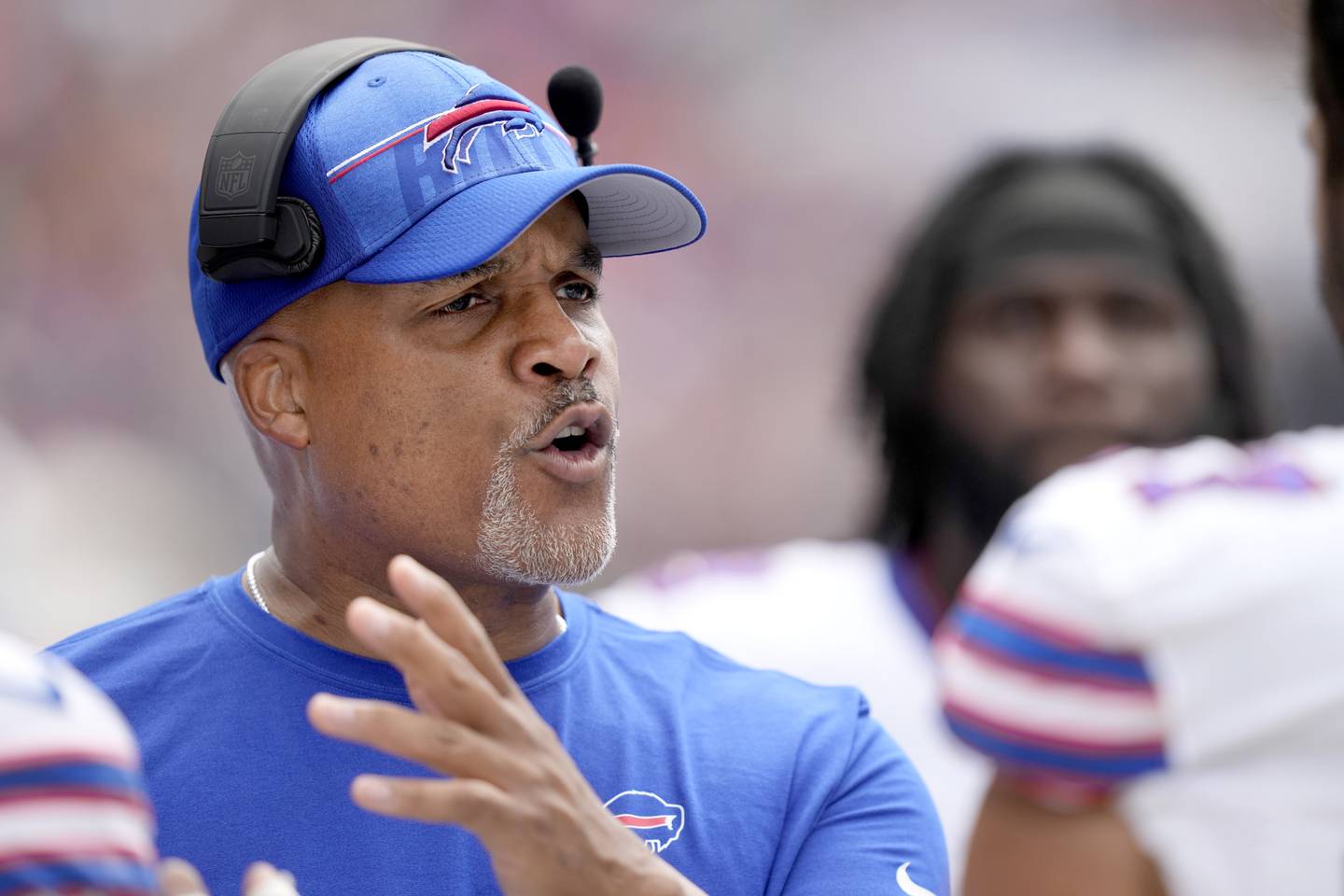 Buffalo Bills assistant head coach/ defensive line Eric Washington talks to his players during an NFL preseason football game against the Chicago Bears Saturday, Aug. 26, 2023, in Chicago.