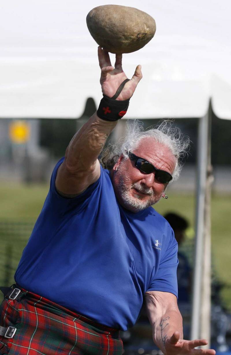 Rick Kramer of Villa Park throws the 23-pound Braemer Stone 24 feet during the amateur competition at the annual Scottish Festival and Highland Games, which will be held in Wheaton this June.