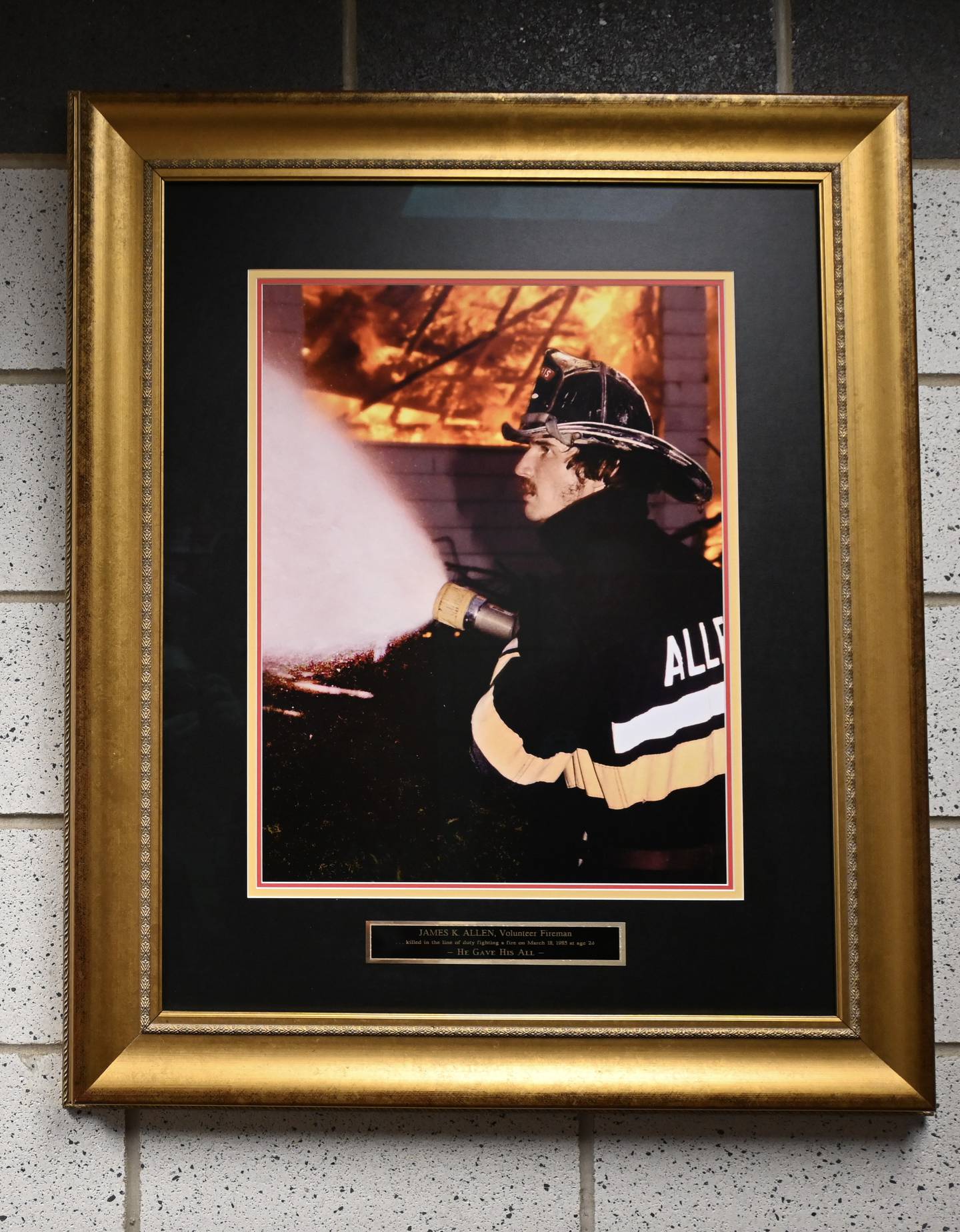 A portrait of James Kenneth Allen, 24, hangs in Morris Fire Protection & Ambulance District Station 2.