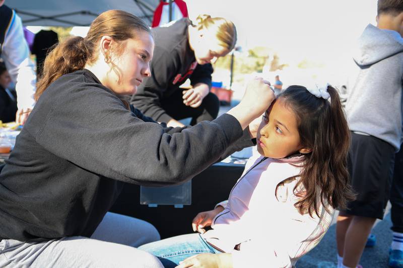 Children have their face painted at the annual Harvest Fest on Saturday, Oct. 19, 2024, at Kirby Park in Spring Valley.