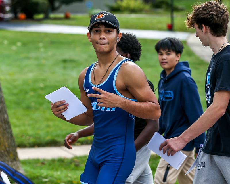 Downers Grove South wrestling athletes march in the Downers Grove South Homecoming Parade. Sept 28, 2024 in Downers Grove.