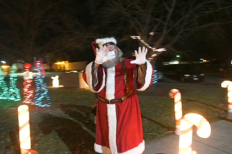 Santa Claus waves to the crowd at Forreston Park after arriving by firetruck in 2020. Santa was headed to the shelter to have chats by the fireplace with kids during Christmas in the Country.