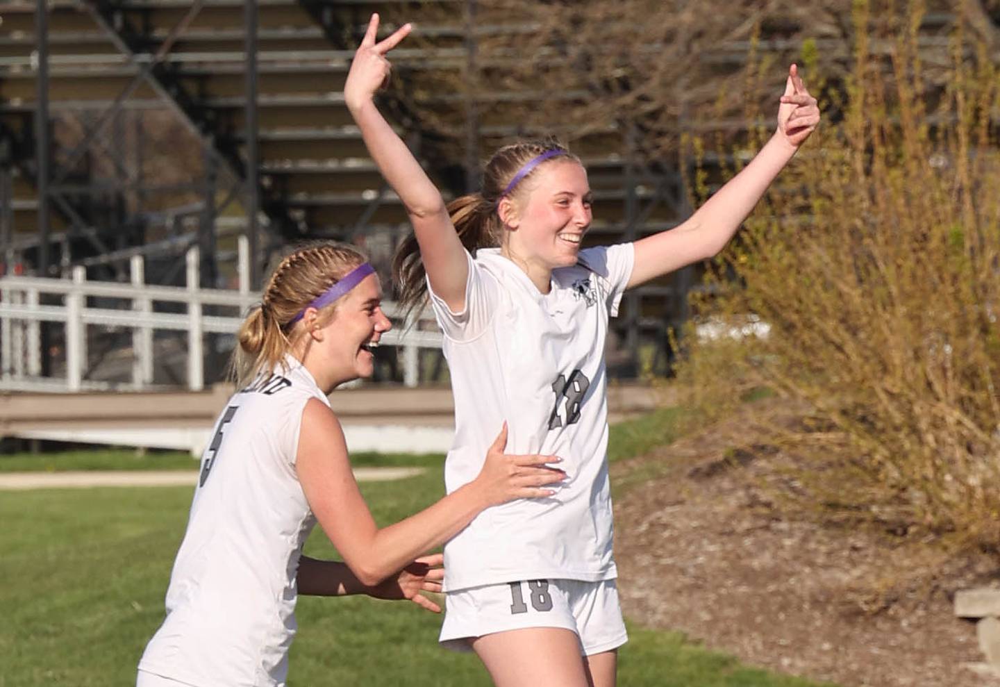 Kaneland's Mallory Nitsche (right) celebrates after scoring her second goal of the day with Brigid Gannon Friday, April 28, 2023, during their game at Sycamore High School.