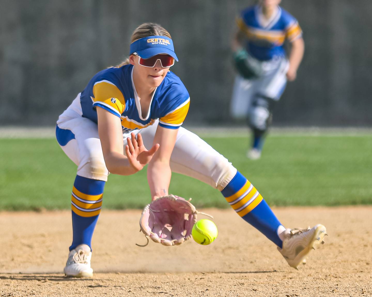 Joliet Central's Haydn Voss (5) fields a grounder at short during softball game between Joliet West at Joliet Central on Tuesday, April 15, 2025  in Joliet.