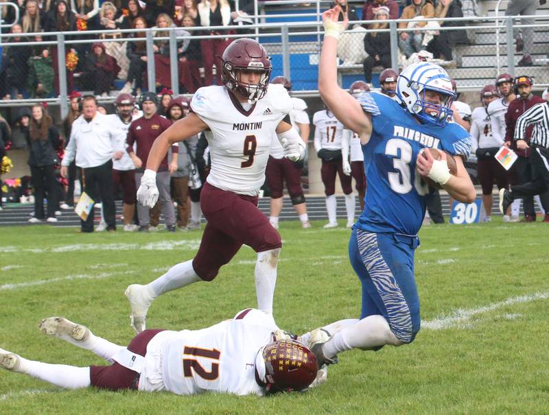 Princeton's Common Green tries to escape a tackle by Montini Catholic's Sean Hubeny during the Class 3A quarterfinal game on Saturday, Nov. 16, 2024 at Bryant Field in Princeton.