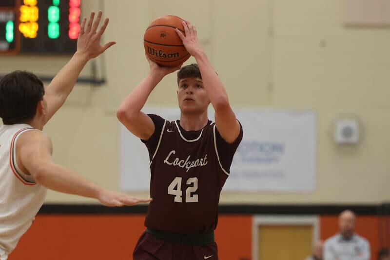 Lockport’s Caden Schoolcraft puts up a shot against Minooka.