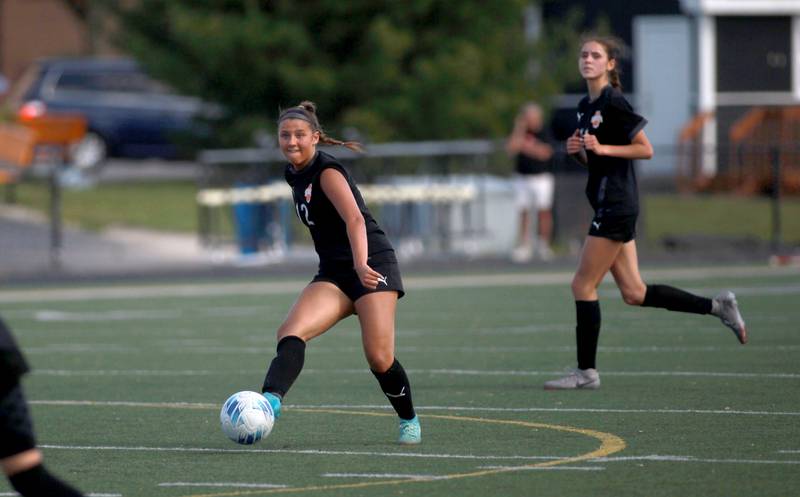 Wheaton Warrenville South's Lucy Jethani kicks the ball during a game against St. Charles East on Friday, May 16, 2025 in Wheaton.