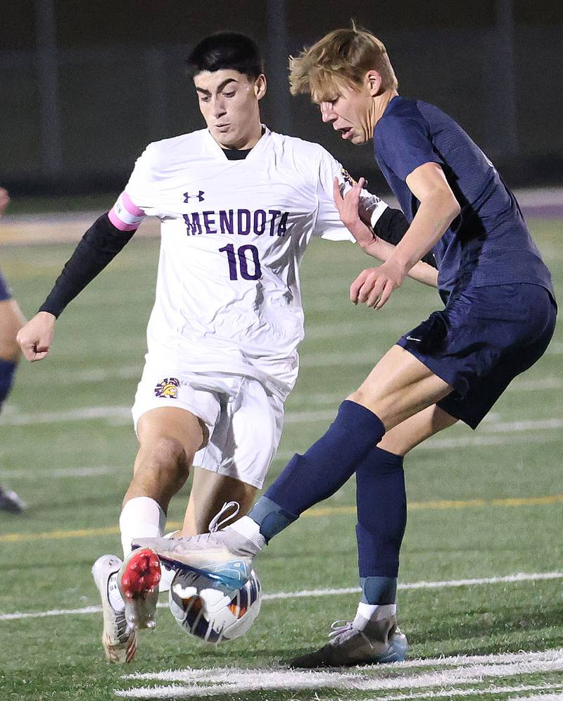 Mendota's Johan Cortez races to the ball with Quincy Notre Dame's Elliott Hendrian during the Class 1A Supersectional game on Monday, Nov. 3, 2025 at Mendota High School.