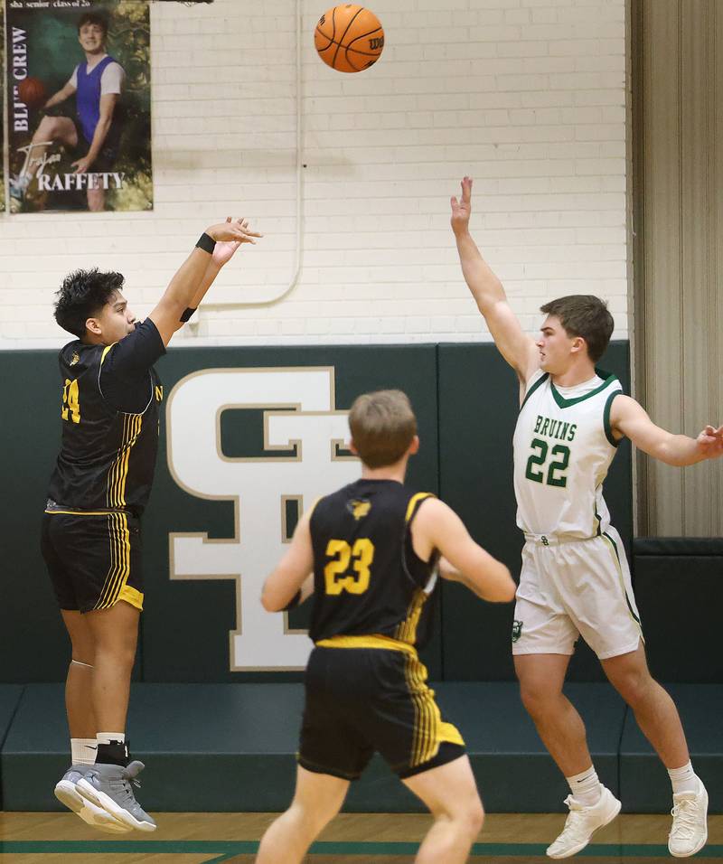 Putnam County's Alan Castro shoots a jump shot over St. Bede's AJ Hermes during the Class 1A Regional quarterfinal game on Monday, Feb. 23, 2026 at St. Bede Academy.