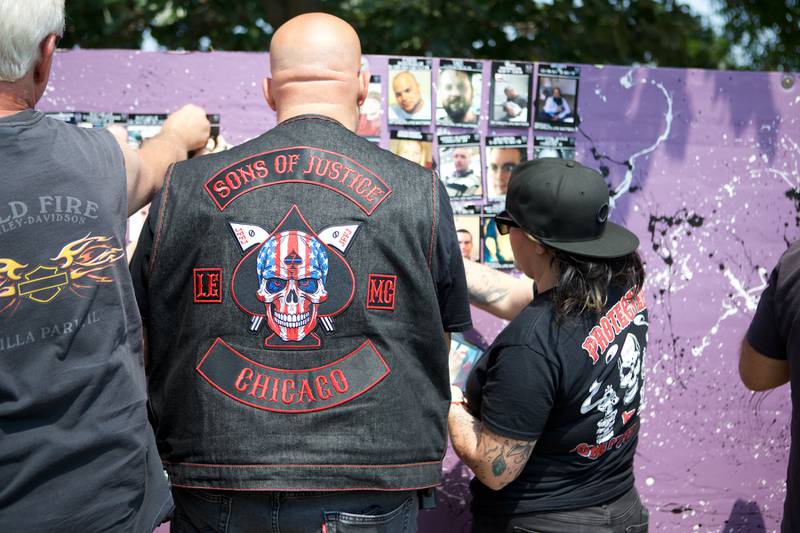 Bikers at the  9th Annual Ride for John pin up pictures to the remembrance wall for my child's life matters on Saturday Aug.2, 2025 in Carol Stream.