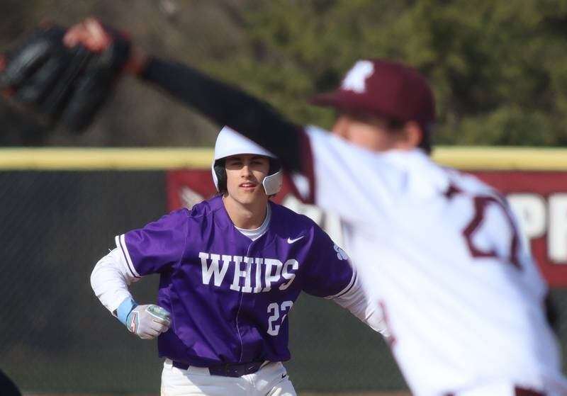Prairie Ridge’s Danny Savas delivers as Hampshire’s Anthony Karbowski gets a lead off second base in varsity baseball on Wednesday, April 16, 2025, at Prairie Ridge High School in Crystal Lake.