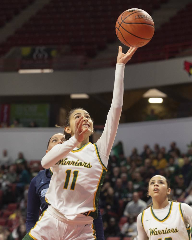 Waubonsie Valley’s Nicole Douglas puts up a rebound against Nazareth Academy Friday, March 1, 2024 in the girls basketball 4A state semifinal at CEFCU Arena in Normal.