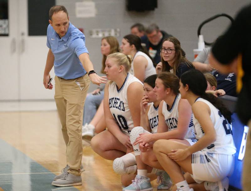 Bureau Valley head girls basketball coach Jon Henegar talks to his players before checking in the game against Riverdale during the Thanksgiving Tournament on Wednesday, Nov. 20, 2024 at Bureau Valley High School.