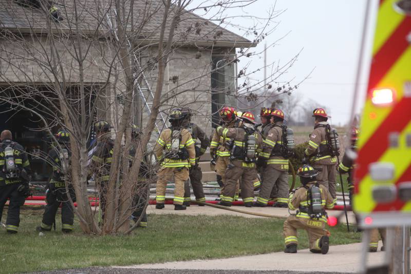 Firefighters work the scene of a structure fire in the 600 block of U.S. Route 6 on Tuesday, April 1, 2025 in La Salle. Fire departments from Peru, La Salle, Utica, Troy Grove, Wallace, Spring Valley and Oglesby were dispatched just before 2:30 to a one-story dublex home.