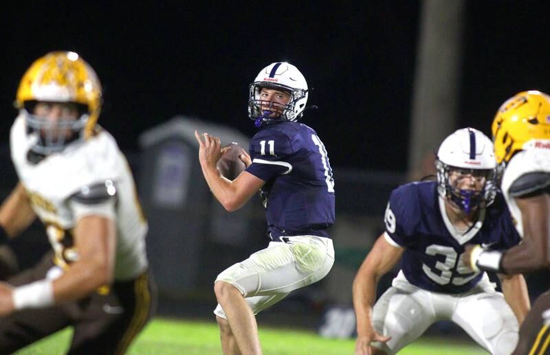 Cary-Grove’s Peyton Seaburg looks for an option against Jacobs in varsity football on Friday, Sept. 20, 2024, at Al Bohrer Field on the campus of Cary-Grove High School in Cary.